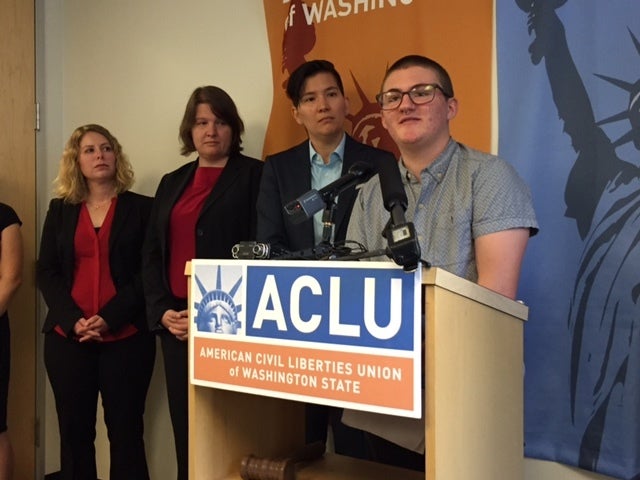<p>Pax Enstad discusses his lawsuit with reporters at ACLU Washington Thursday.</p>