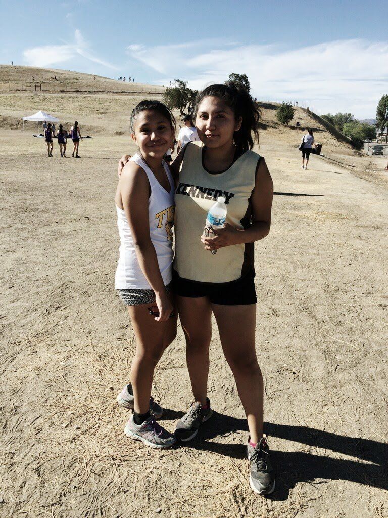 Citlaly Ortega, right, with her friend Reanna Casarez at a cross-country meet in October 2016.