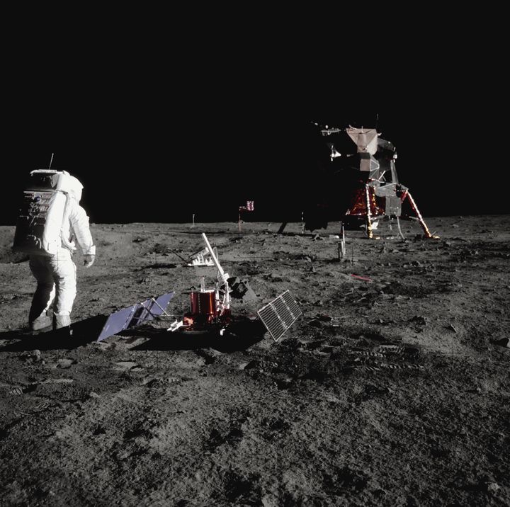 Buzz Aldrin walks by some scientific equipment on the surface of the Moon during the Apollo 11 mission.