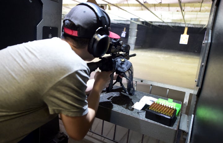 A gun enthusiast fires his AR-15 rifle toward a target at the LAX Firing Range in Inglewood, California, on Sept. 7, 2016.