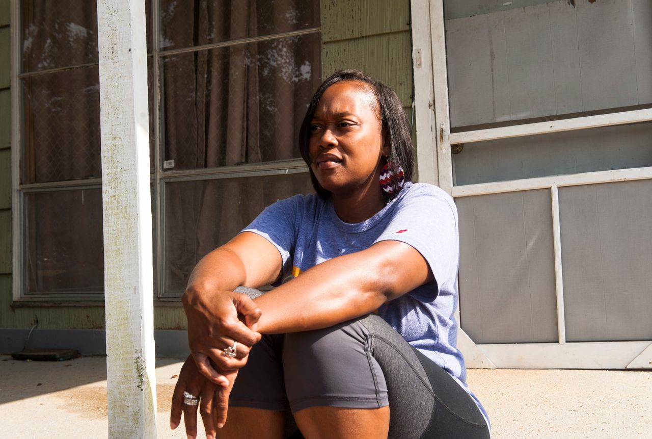 Sheena Godbolt, 33, sits on her sister's porch in Bogue Chitto.