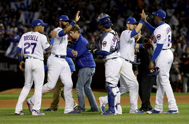 The Chicago Cubs celebrate after beating the San Francisco Giants at Wrigley Field on Oct. 8, 2016. 