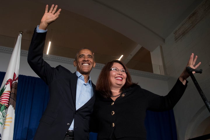 President Barack Obama waves to the crowd with Rep. Tammy Duckworth, D-Ill., during an event in Chicago on Oct. 9, 2016.