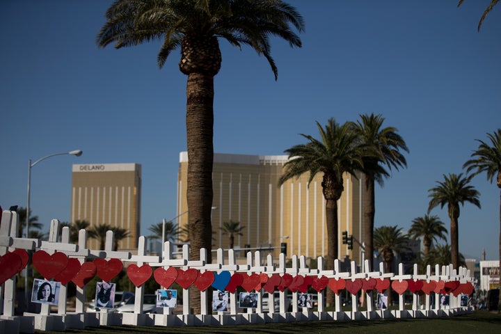 With the Mandalay Bay Resort and Casino in the background (at right), 58 white crosses for the victims of Sunday night's mass shooting stand on the south end of the Las Vegas Strip, October 5, 2017 in Las Vegas, Nevada. 