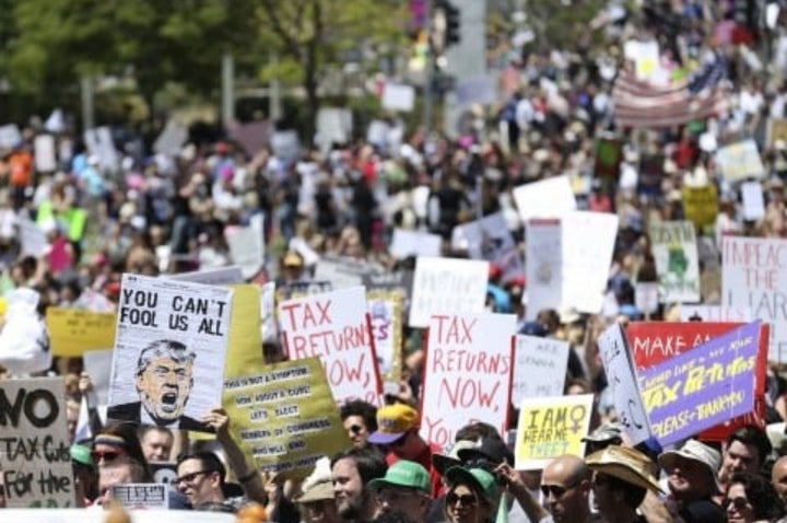 <p>People protest against Trump’s tax cuts in Los Angeles</p>