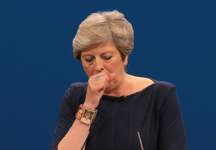 Theresa May struggled to complete her conference speech, as it was disrupted by a prankster and she suffered from a cold