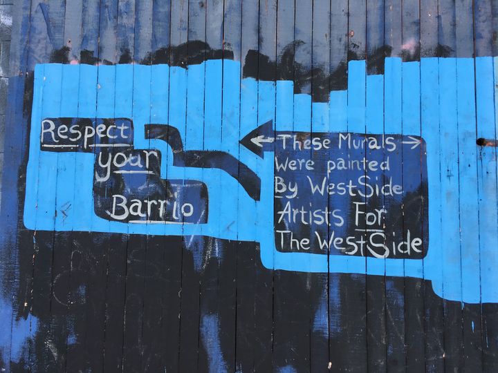 <p>A warning, or an encouragement, to appreciate Westside murals, painted by residents for residents.</p>
