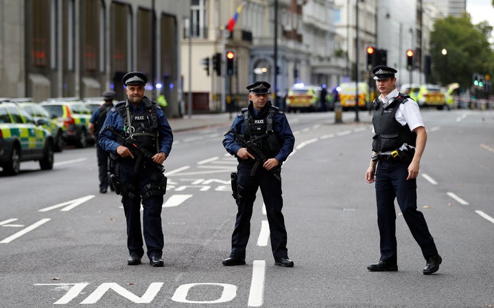 <strong>Police officers stand in the road outside the Natural History Museum</strong>