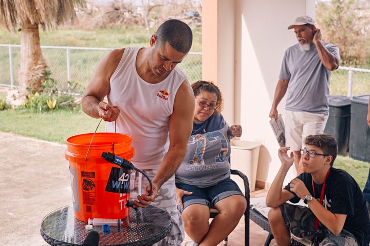 Crazy Legs demonstrates how to assemble a water filtration system at his home in Isabela, Puerto Rico on September 30, 2017