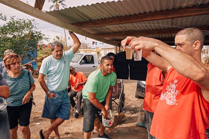 Crazy Legs shows the results of the water filtration system to his neighbors in Isabela, Puerto Rico on October 1, 2017.