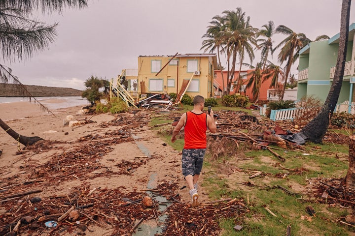 <p>Crazy Legs photographs ravaged bungalows of the Villas del Mar Hau Hotel on the Montones Beach in Isabela, Puerto Rico on September 29, 2017</p>