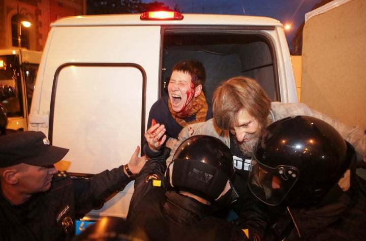 Police officers detain supporters of Russian opposition leader Alexei Navalny during a rally in St. Petersburg, Russia Octobe