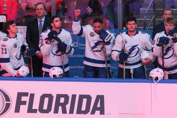 The Tampa Bay Lightning's J.T. Brown protests during the national anthem before the start of a game against the Florida Panthers at the BB&T Center in Sunrise, Fla., on Saturday, Oct. 7, 2017. 