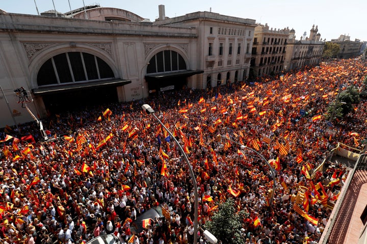 A pro-union demonstration organised by the Catalan Civil Society organisation makes its way through the streets of Barcelona,