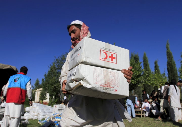 Attacks on Red Cross workers has prompted the humanitarian organization to cut back on services in Afghanistan.