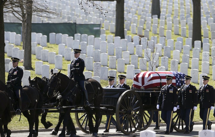 The caisson and casket are seen in procession before a burial service for U.S. Army Sergeant First Class Matthew McClintock, who was killed in action in Afghanistan, at Arlington National Cemetery in Virginia March 7, 2016.