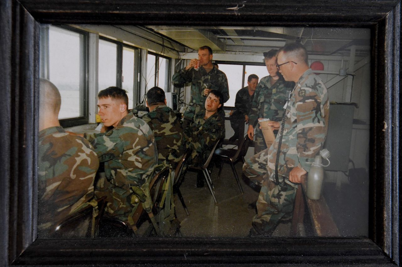In this photo, Suzanne Wheeler (standing, with soda) is seen prior to her transition with the tank company she commanded. The photo, taken in July 1994, now sits on the desk in Wheeler's home office.
