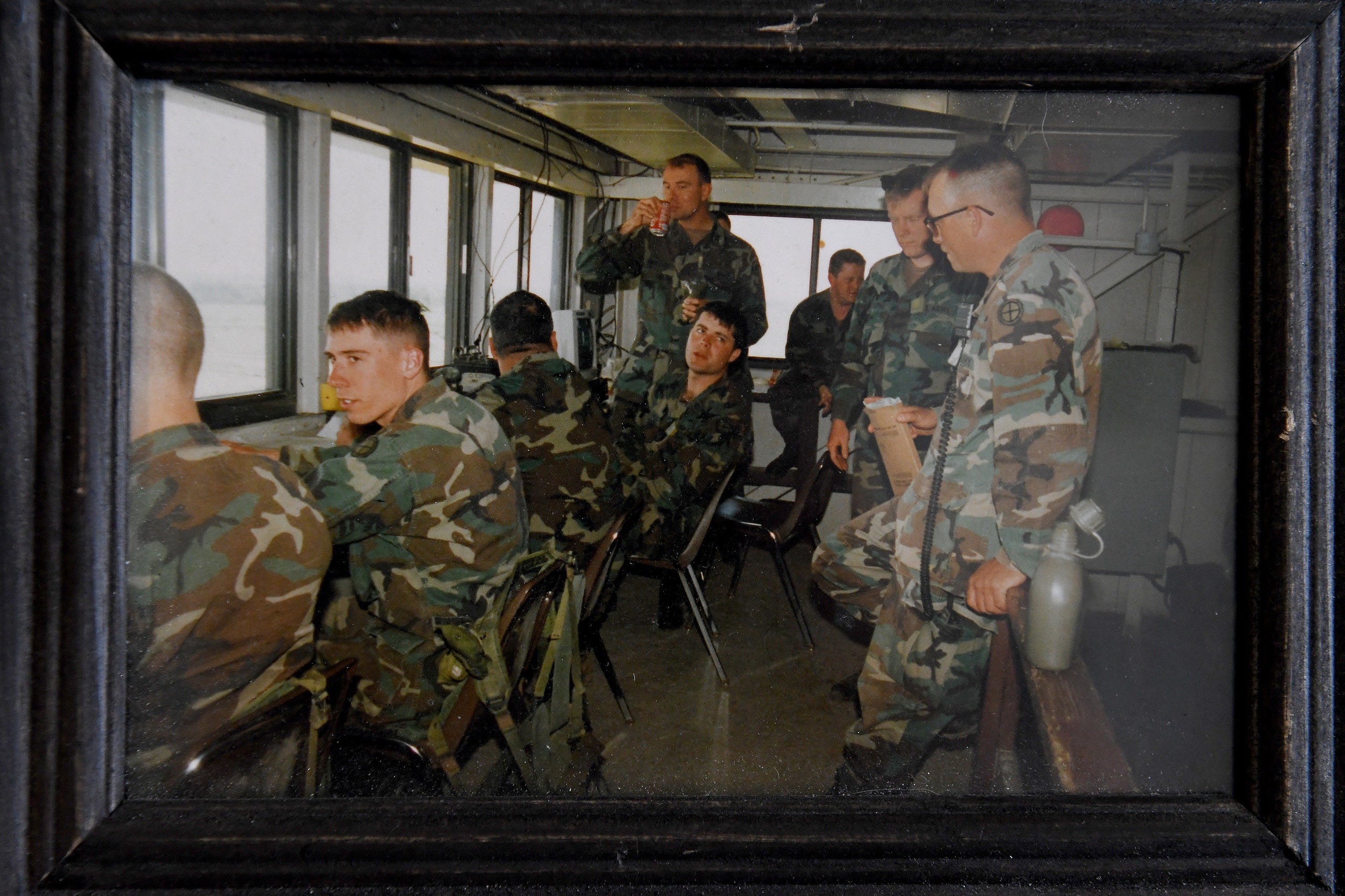 In this photo, Suzanne Wheeler (standing, with soda) is seen prior to her transition with the tank company she commanded. The