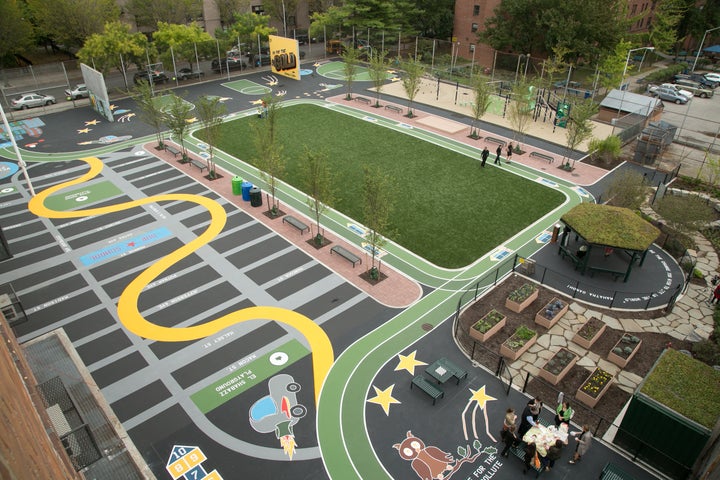 The old asphalt schoolyard at La Cima Charter School in Brooklyn, NY was converted by The Trust for Public Land to a green community playground that also captures stormwater runoff.