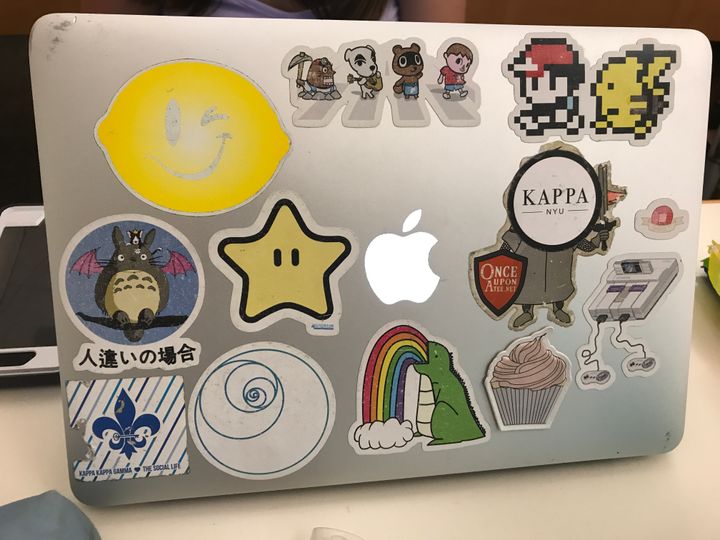 <p>Apple computers once badge brands are being covered in stickers</p>