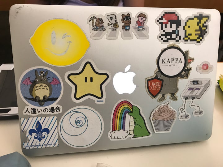 Apple computers once badge brands are being covered in stickers