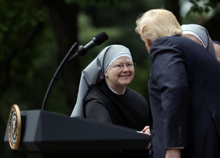 Trump shakes hands with a nun of the Little Sisters of The Poor during a National Day of Prayer event at the Rose Garden of the White House in Washington, D.C., on May 4, 2017.