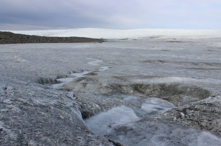Meltwater flows from the face of the Russell Glacier, located about 16 miles east of Kangerlussuaq. The glacier serves as a popular attraction for scientists and tourists.