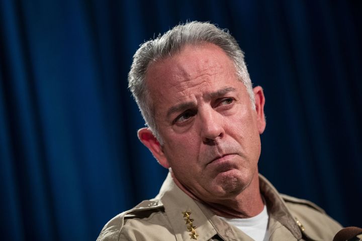 Clark County Sheriff Joseph Lombardo says Paddock's motives are still unclear, but revealed he had a document in the room with him that contained numbers and had been shooting at fuel tanks 
