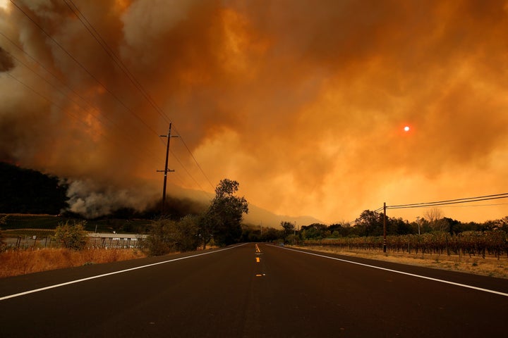 Smoke covers the sun as a wildfire from the Santa Rosa and Napa Valley moves through the area.