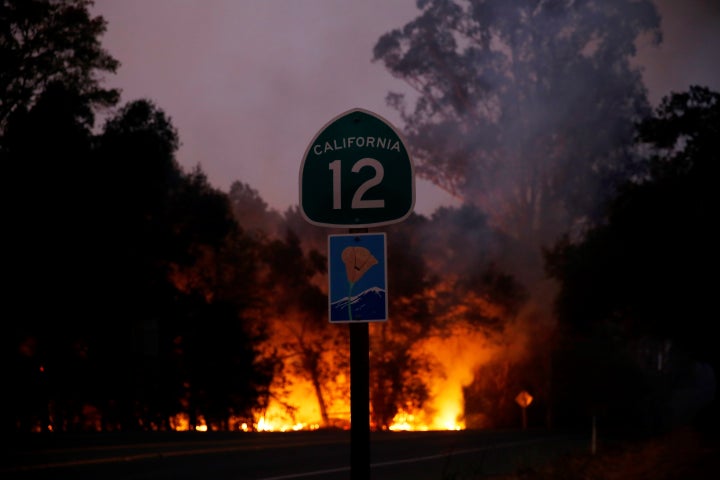 Smoke and flames rise as a wildfire from California's Santa Rosa and Napa Valley moves through the area on Oct. 10, 2017.