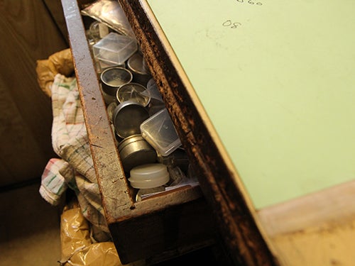 <p><strong>Marcel’s workbench, scarred by time.</strong></p>