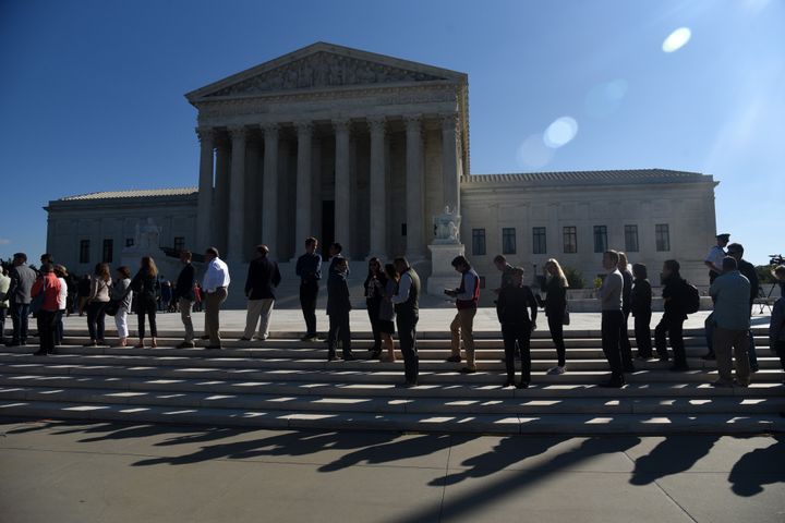 WASHINGTON, DC – People wait in line outside of the Supreme Court to hear oral arguments in Gill v. Whitford on October 3, 2017 in Washington, DC.
