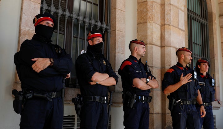 Mossos d'Esquadra, Catalan regional police officers, stand guard outside the Catalonian regional parliament in Barcelona, Spain, October 10, 2017.