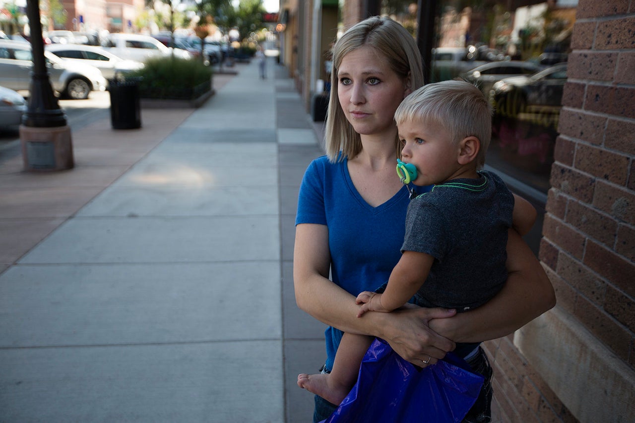 Marlayna Walker holds her 18-month-old son, Zeke, in downtown Gillette, Wyoming. While she has opinions on hot-button social issues, Walker doesn't necessarily want the state legislature to pass laws on those topics.