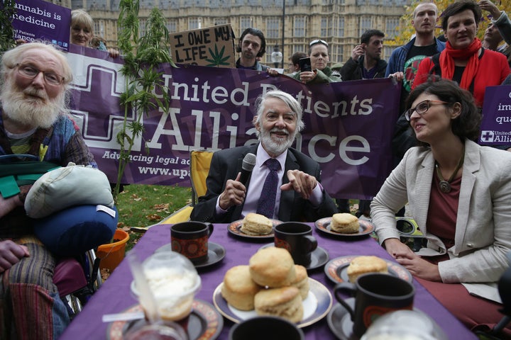 Labour MP for Newport West, Paul Flynn (C) and Liberal Democrat MP for Oxford West and Abingdon, Layla Moran (R), speak during a 'Tea Party' organised by the United Patients Alliance 