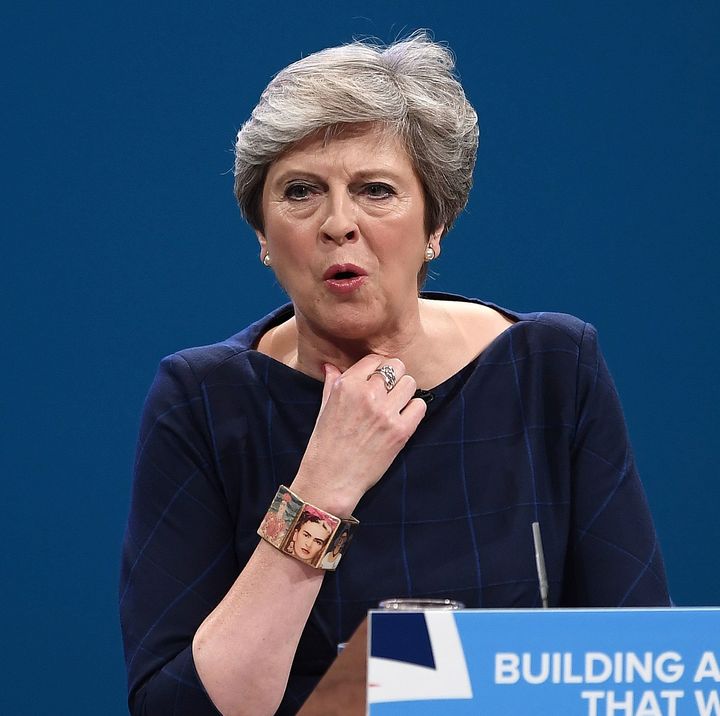 Theresa May struggles with a cough as she delivers her keynote speech at Tory party conference.