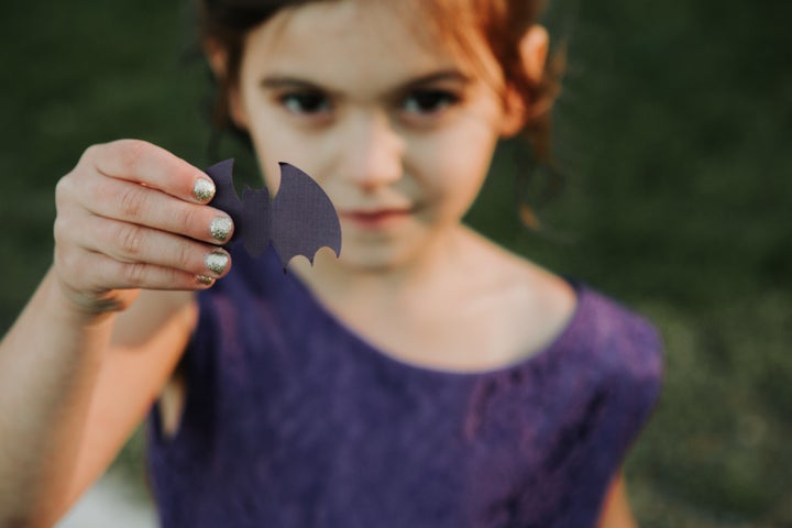 Paper bats were thrown instead of petals. 