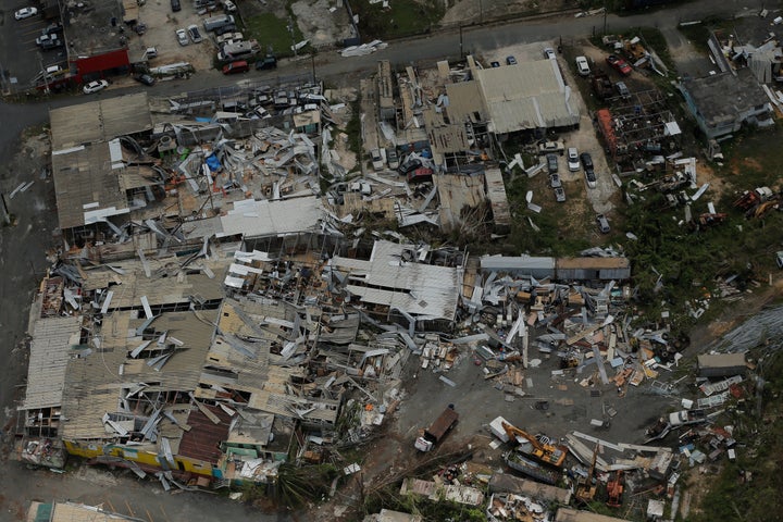 Aluminum roofing is seen twisted and thrown off buildings as recovery efforts continue following Hurricane Maria near San Jose, Puerto Rico, on Oct. 7.