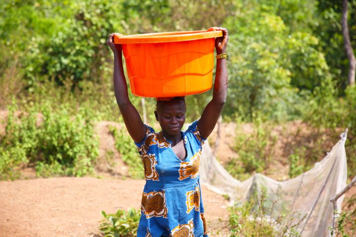 Women carrying water from a Concern-constructed water point at Boyali, Central African Republic. The water point is now managed by the local community.