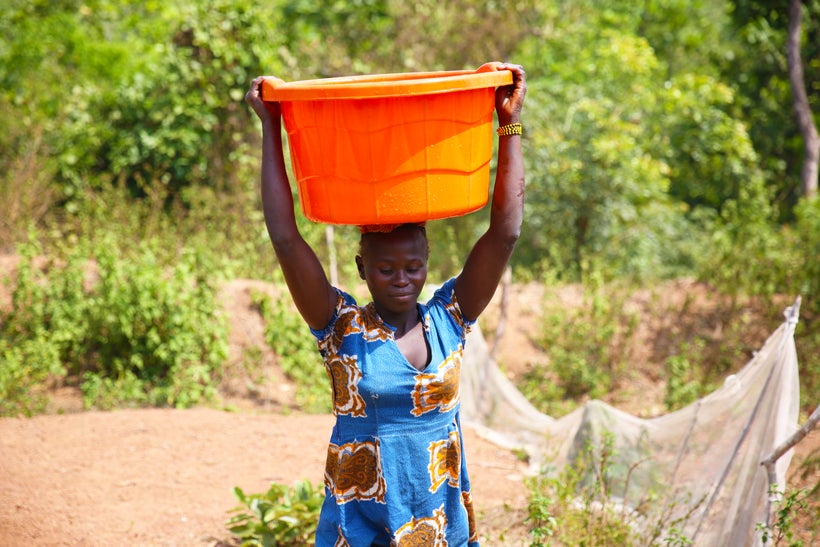 Women carrying water from a Concern-constructed water point at Boyali, Central African Republic. The water point is now manag