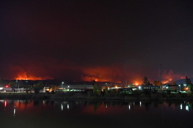 Today, a somber view of fires in the hills illuminating the surrounding area of Atlas Peak Fire in Napa,.