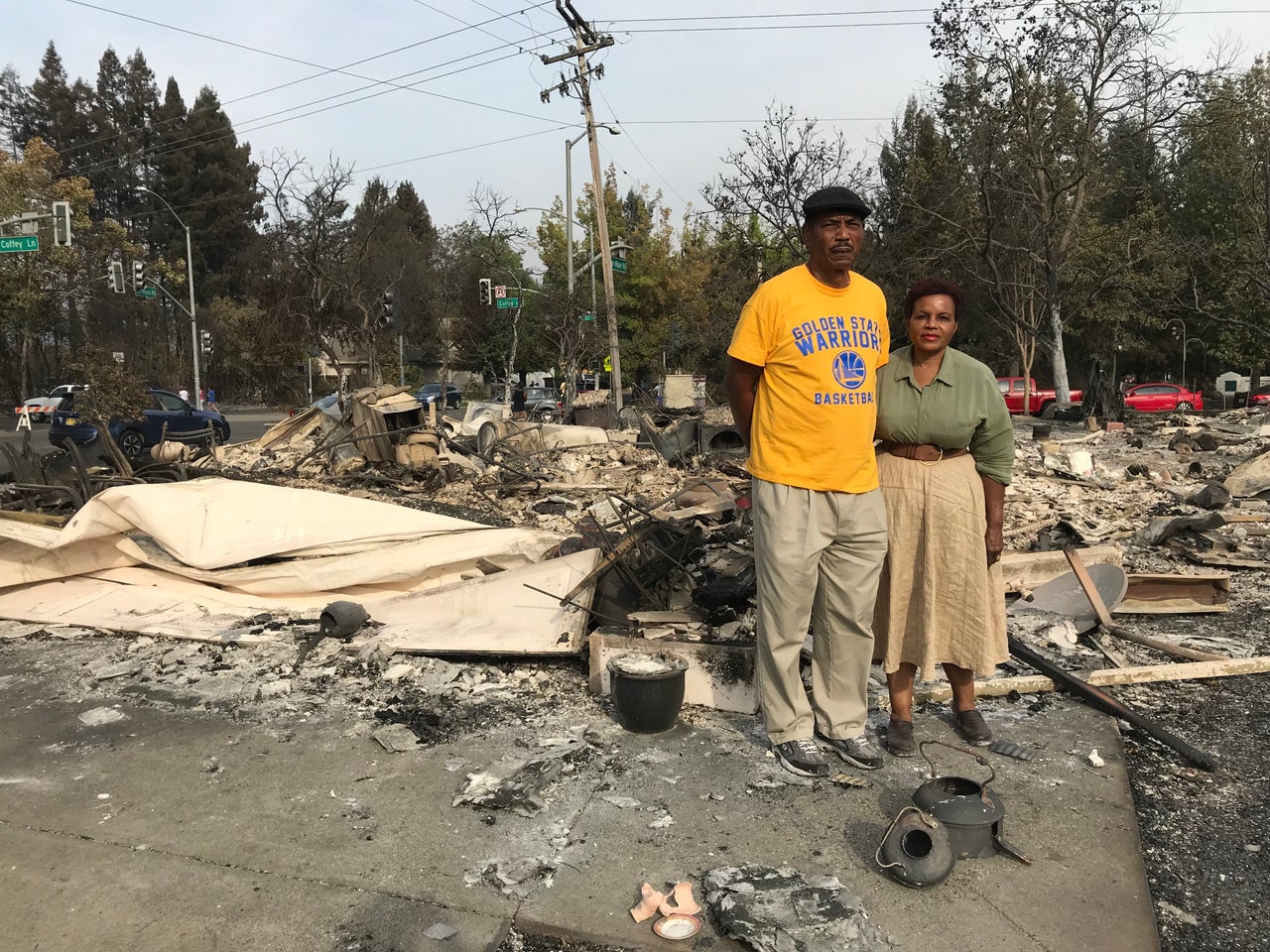 Marion Heim, right, and husband Lloid Heim stand on the ashes where their house used to be, in the days after the fire -- Oct. 2017, Santa Rosa, Calif.