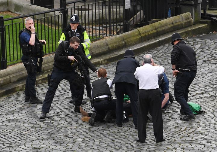 Police point a gun at fatally wounded Westminster attacker Khalid Masood, who used a rented car and a knife to kill X people in March. The Sentencing Council described him as part of a 'new category' of terrorist 