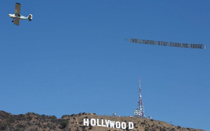 "Hollywood: Stop enabling abuse," the sign read. 
