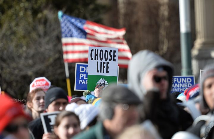 Anti-abortion protesters march in Washington, D.C., at the annual March for Life in January. Official government language establishing that life begins at conception could tilt the scales toward more infringement on women's reproductive choices.