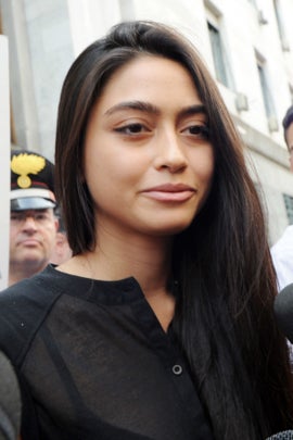 MILAN, ITALY - JULY 19:  Ambra Battilana lspeaks to waiting media outside the courthouse after the verdicts in the 'Ruby bis' case on July 19, 2013 in Milan, Italy. Nicole Minetti, Emilio Fede and Lele Mora were found guilty of aiding and abetting in the procurement of prostititutes for 'bunga bunga' parties held by former Italian prime minister Silvio Berlusconi. (Photo by Pier Marco Tacca/Getty Images)
