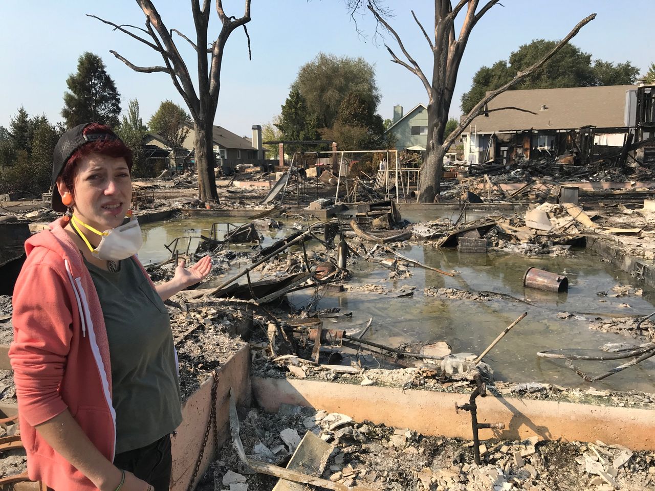 Kat Keller stands in front of what used to be her family's home.