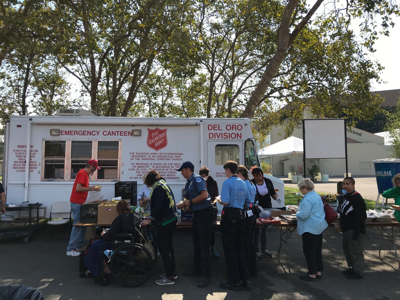 Evacuees and emergency workers line up for food at the Red Cross shelter at the Sonoma County Fairgrounds in Santa Rosa on Oct. 11.