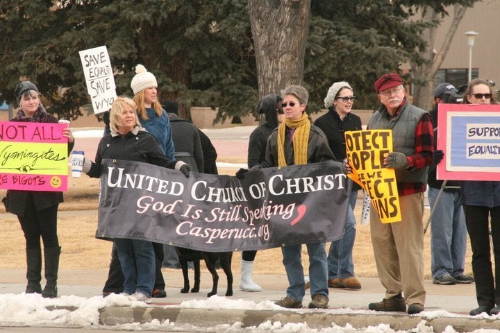 Rev. Dee Lundberg and Casper UCC members protest the Defense Of Marriage Act.