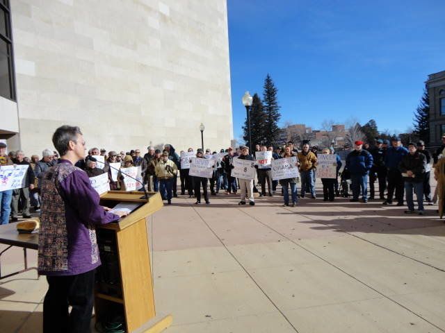 Rev. Dee Lundberg speaks at a rally to protect children's access to education